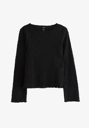 Maglietta nera a maniche lunghe con una texture a motivo ondulato. Presenta un collo rotondo e un orlo corto. Realizzata in tessuto leggero.