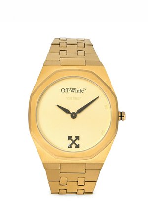Gold metal wristwatch with a simple round face, black hour and minute hands, Off-White logo, and "ON TIME" text on the dial.