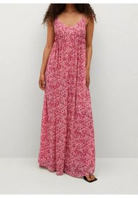 Robe maxi à bretelles spaghetti, avec un motif floral rose, coupe ample et tissu léger pour un confort optimal.