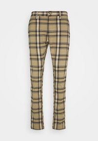 Beige plaid trousers with black and white stripes, featuring a straight fit and two front pockets, made from soft fabric.