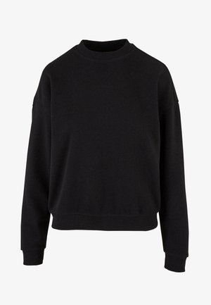 Černá mikina vyrobená z měkké bavlny má kulatý výstřih, spadlá ramena a žebrované manžety s uvolněným střihem.