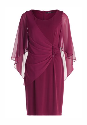 Robe mauve avec des manches fluides en voile, des détails froncés à la taille et un col rond. Se ferme au dos avec une fermeture éclair.