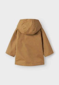Rudas gaubtas, lygus paviršius, vidutinio ilgio, ilgos rankovės ir tiesus hem. Yra paprastas dizainas be matomų detalių.