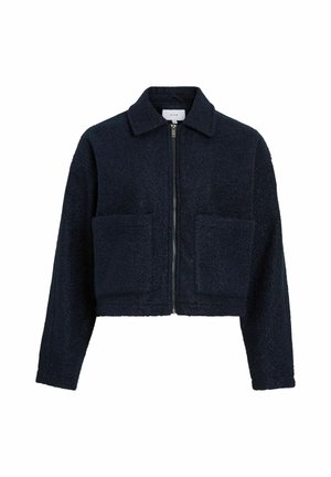 Veste courte bleu marine en tissu texturé, avec une fermeture éclair à l'avant, un col élégant et deux grandes poches avant.