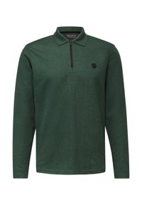 Zielony longsleeve polo z kołnierzykiem na zamek, faktura prążkowana i okrągły czarny akcent logo na lewej piersi.