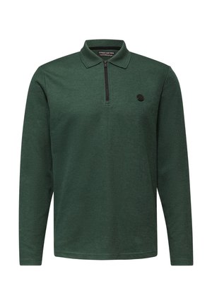 Polo verde a maniche lunghe con colletto con zip, texture a coste e logo rotondo nero sul lato sinistro del petto.