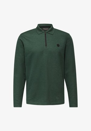 Polo verde a maniche lunghe con colletto con zip, texture a coste e logo rotondo nero sul lato sinistro del petto.