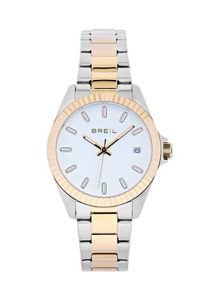 Sølv- og guld-tone metalur med en hvid skive, tekstureret guld bezel, rektangulære timemarkører og datovisning kl. 6.