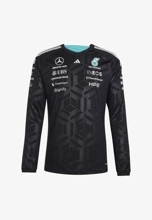 Zwart, langärmelig racetrui met een geometrisch patroon en meerdere sponsornamen, waaronder Mercedes, Petronas, UBS en INEOS op borst en mouwen.