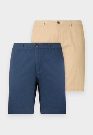 Kaks paari lühikesi pükse: üks tumesinine ja teine beež. Valmistatud pehmest kangast, varustatud nööbiga sulgemisega ja sirge lõikega disainiga.