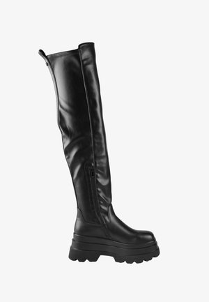 Stivale nero in pelle fino al ginocchio con suola piattaforma chunky e cerniera laterale.
