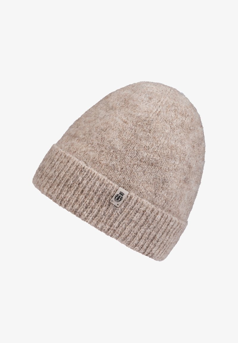 Beige knitted beanie hat with a ribbed cuff, made of soft wool blend material. Features a small logo patch on the side.