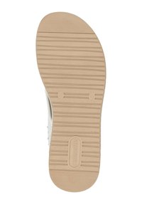Semelle de chaussure couleur beige clair avec un motif texturé et nervuré, dotée d'un bout arrondi et d'un logo de marque en relief. Des rainures étroites améliorent l'adhérence.