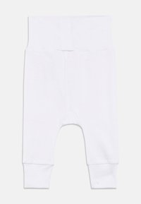 Hvite babyleggings med høy midje og brettede mansjetter, lagt flatt på en hvit bakgrunn.