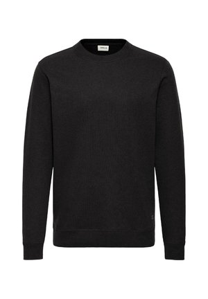 Sudadera negra de cuello redondo con textura acanalada, mangas largas y dobladillo recto. Presenta una pequeña etiqueta de logo cerca de la parte inferior izquierda.