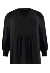 Svart blus med V-ringning, puffärmar och rynkad detalj vid midjan. Tillverkad av ett mjukt tyg, den har minimaliska designelement.