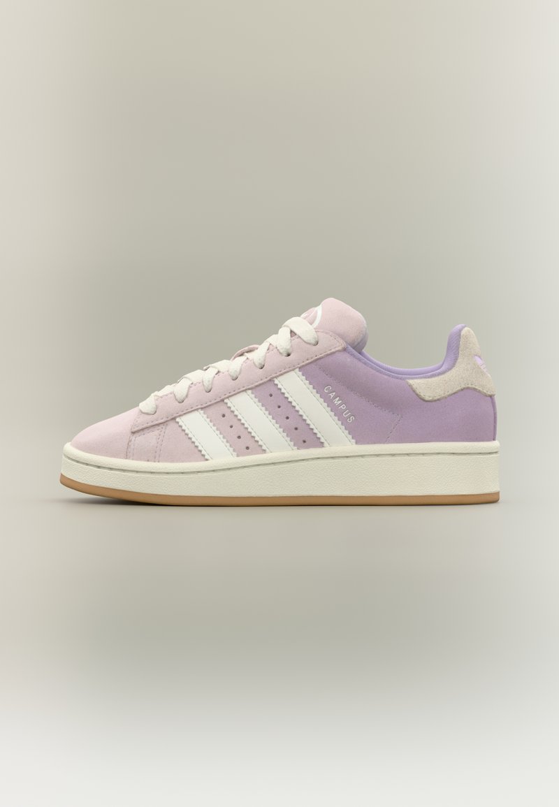 Purple suede sneaker with white stripes, rubber sole, and suede accents. Lace-up design with cushioned collar and perforated detailing.