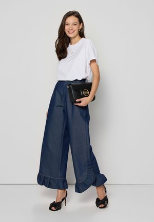 NELLA - Flared Jeans - dark blue denim