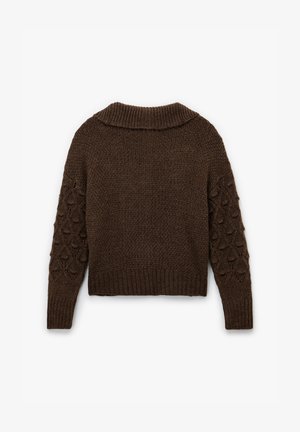 Brown knitted sweater with a ribbed collar, textured body, and patterned sleeves featuring raised teardrop shapes. Cropped length.