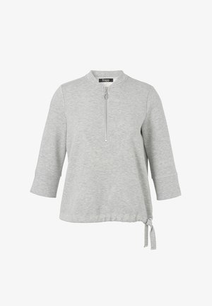 Lichtgrijze longsleeve top met een kwart ritssluiting, ronde halslijn en verstelbaar trekkoord aan de onderkant.
