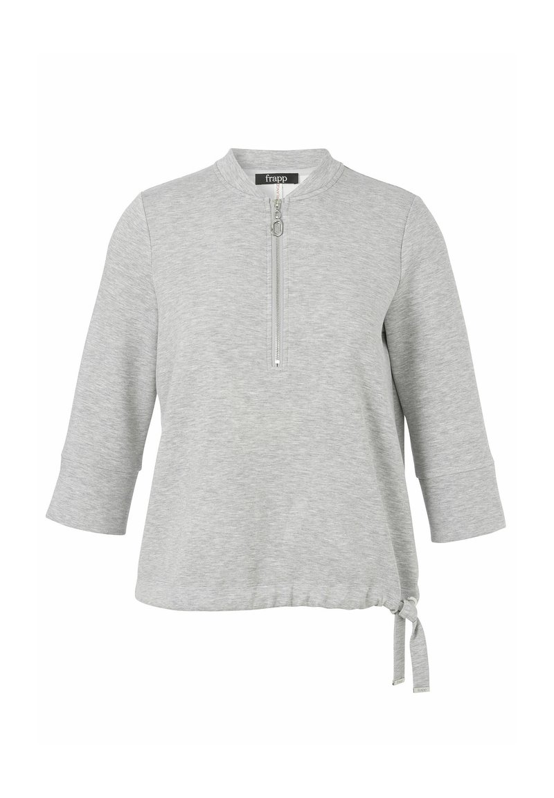 Lichtgrijze longsleeve top met een kwart ritssluiting, ronde halslijn en verstelbaar trekkoord aan de onderkant.