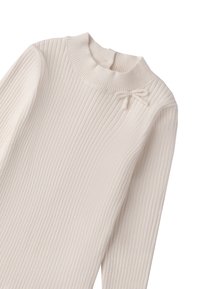 Maglione a coste crema con collo alto, maniche lunghe e un piccolo fiocco decorativo sulla spalla sinistra. Texture morbida, design aderente.