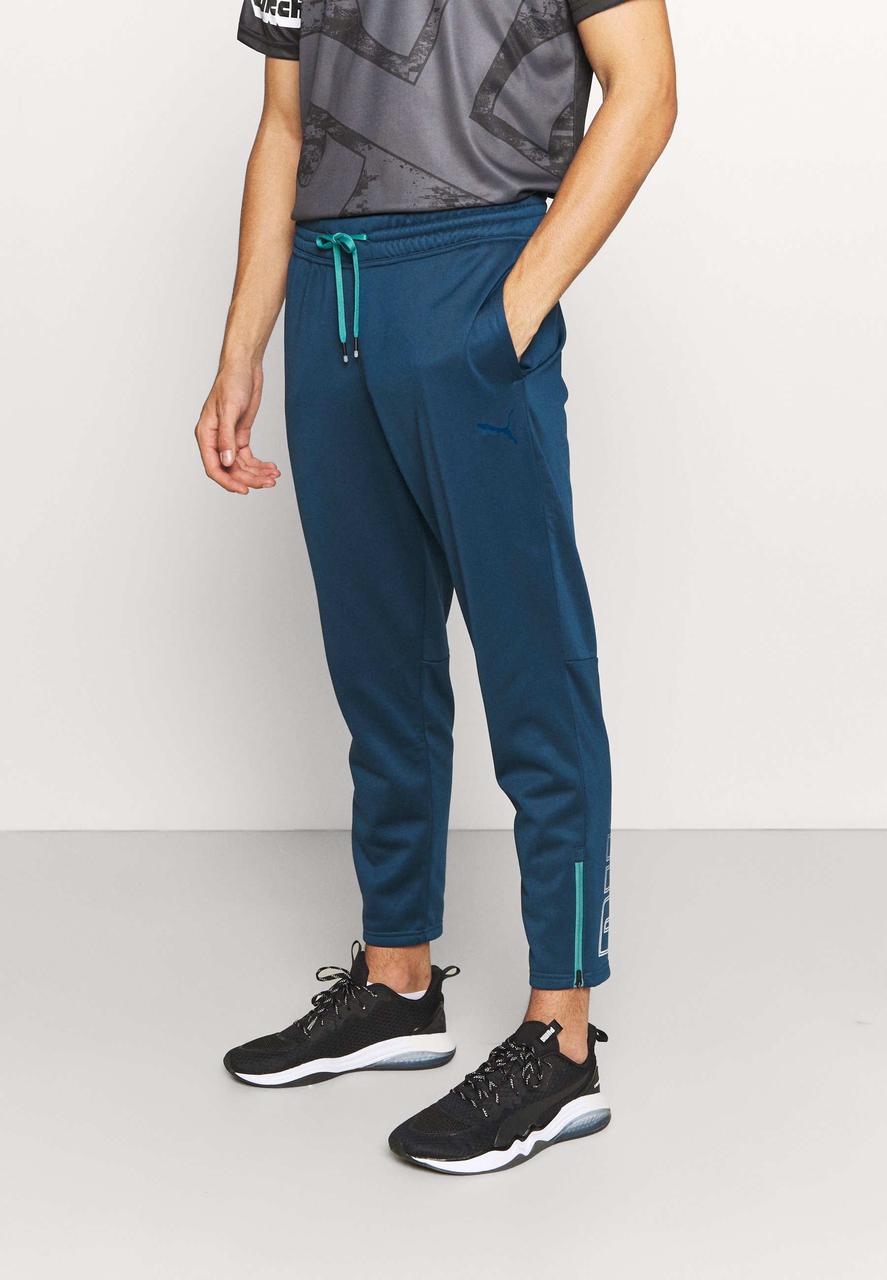 Puma FADE - Tracksuit bottoms - intense 