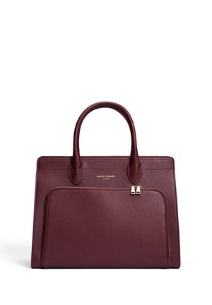 Burgundy leather handbag with two handles, zippered front pocket, textured surface, and gold-tone hardware accents. Rectangular shape.