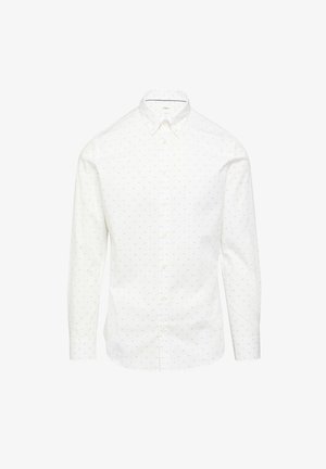 Chemise blanche à manches longues, avec un motif à pois subtil et un col classique. Fabriquée en tissu coton avec une texture lisse.