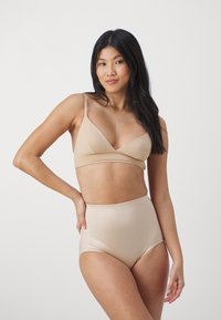 Beige bralette and high-waisted underwear set. Soft, smooth fabric with a seamless design and thin straps. Simple, minimalistic style.