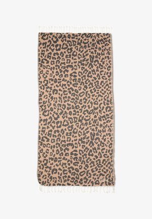 Beżowa prostokątna tkanina z czarnym wzorem w cętki lamparta i białymi frędzlami na obu krótszych krawędziach.