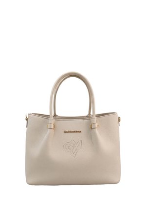 Beige leather handbag with dual handles, gold logo lettering, and a perforated "GM" heart design on the front.