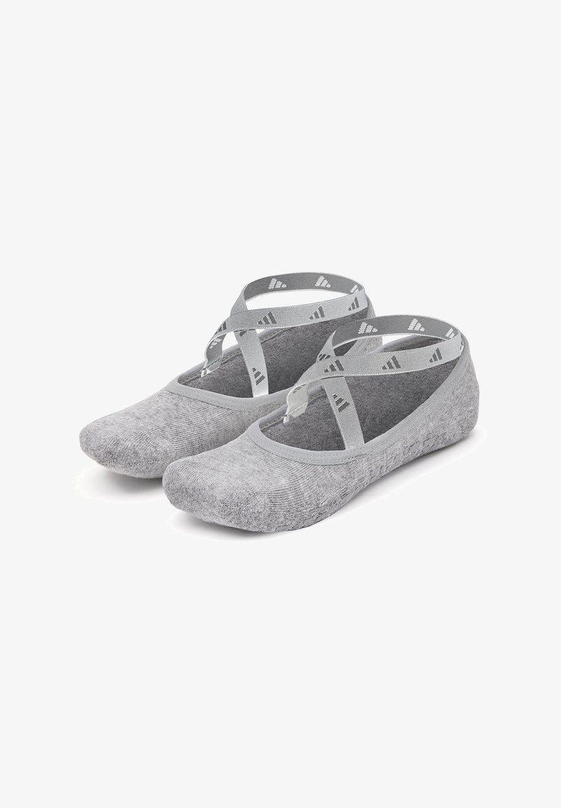 Gray ballet flats made of soft fabric with a textured finish, featuring crossover gray straps and a rounded toe design.