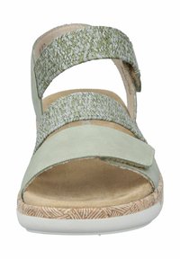 Sandali verdi e beige con due cinturini texturizzati, una soletta morbida e suola in gomma con motivo. Accenti in pelle liscia nella parte anteriore.