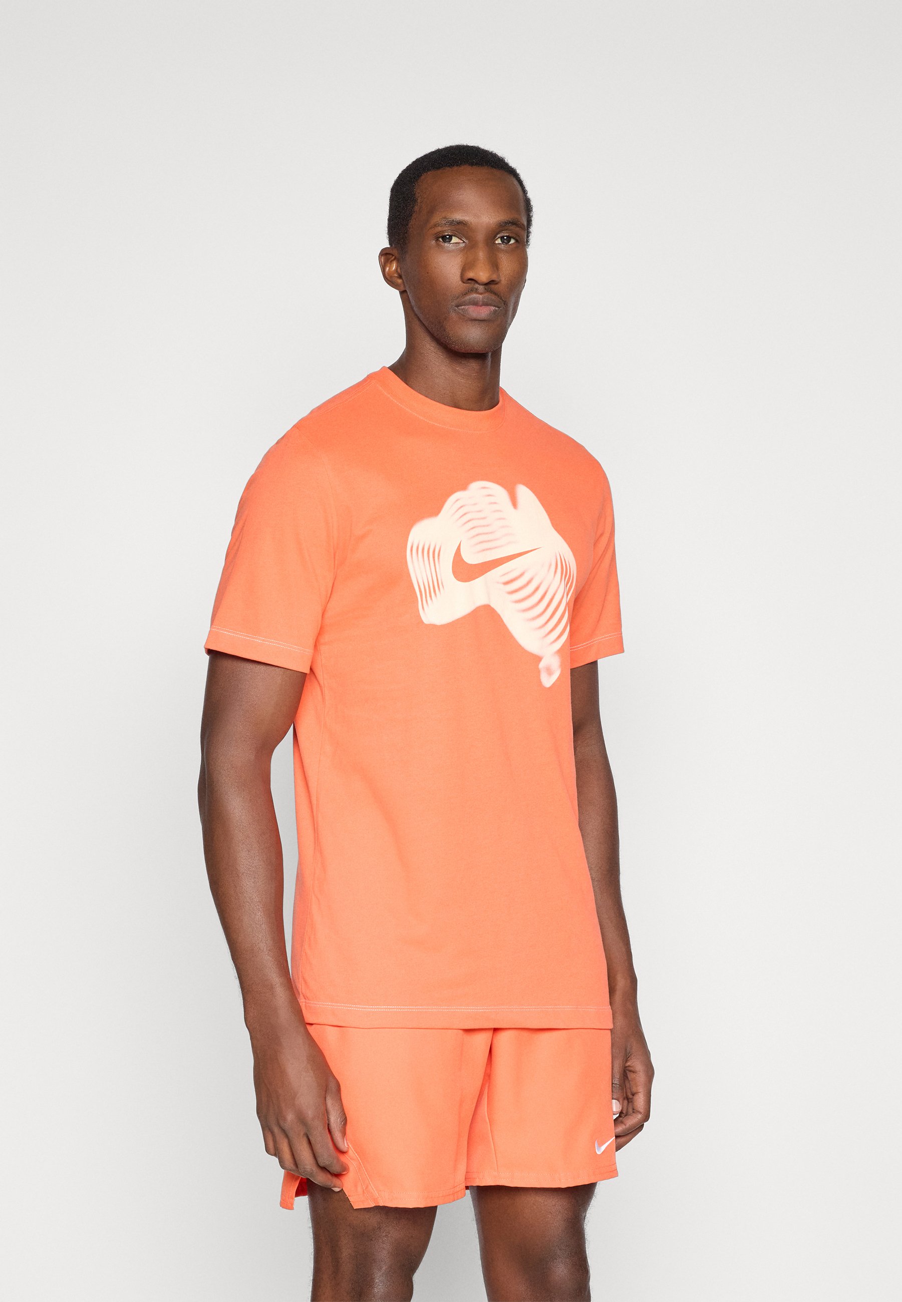 turf orange nike shirt