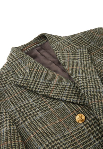 Blazer in lana a quadri nei toni verde, marrone e blu; presenta un colletto a rever e un dettaglio di pulsante dorato. Fodera interna marrone.