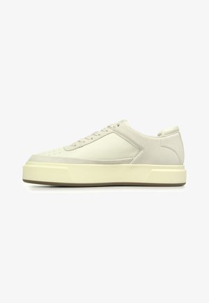 Sneakers featuring a cream leather upper with gray suede accents, round toe, six-eyelet lace closure, and a thick cream rubber sole.