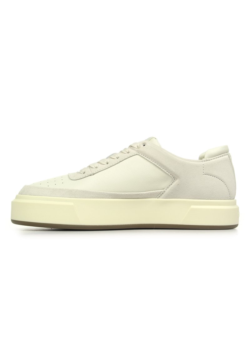 Sneakers featuring a cream leather upper with gray suede accents, round toe, six-eyelet lace closure, and a thick cream rubber sole.