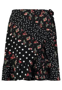 Svart kjol med vita prickar och röda blommönster, med en volangkant och sidoknytning. Lätt tyg, omlottstil.