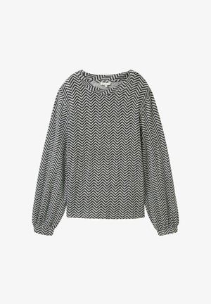 Fekete-fehér halszálkás mintájú hosszúujjú blúz, kerek nyakkivágással és enyhén puffos ujjal, rugalmas mandzsettával.