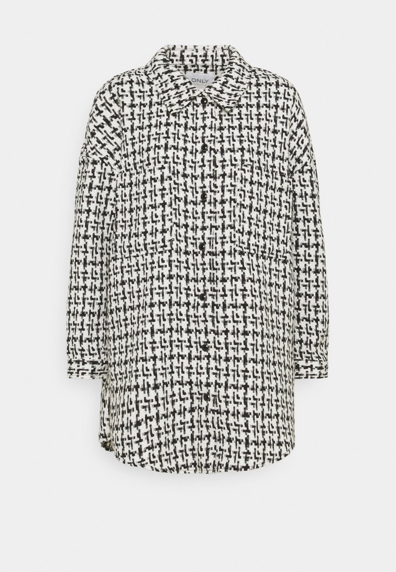 Svart och vit rutig skjorta jacka med långa ärmar, knappstängning och avslappnad passform. Tillverkad av ett texturerat tyg.