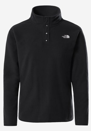 Pull-over en polaire noire avec manches longues, col montant, trois boutons-pression et logo The North Face sur la poitrine gauche.