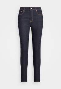 Mörka denim skinny jeans med hög midja, orange sömnad, fem fickor och en slät yta.