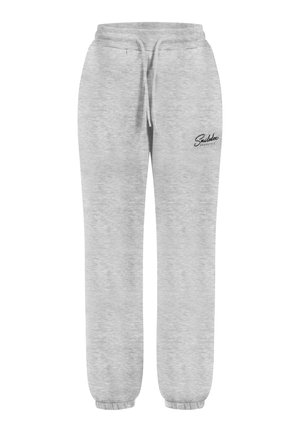 Pantalones de chándal grises hechos de una tela suave, con una cinturilla elástica con cordón y puños elásticos, adornados con un pequeño logo negro.