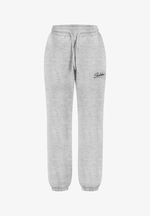 Pantalones de chándal grises hechos de una tela suave, con una cinturilla elástica con cordón y puños elásticos, adornados con un pequeño logo negro.