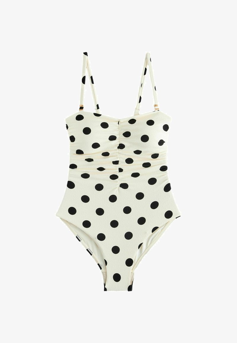 Maillot de bain une pièce blanc à pois noirs, froncé au centre devant, avec bretelles fines réglables.