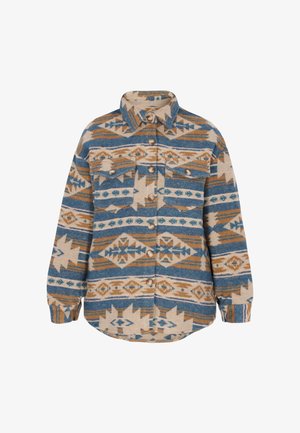 Woven button-up shirt in beige with blue and brown geometric patterns. Features two chest pockets and a rounded hem. Soft, textured material.