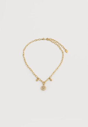 Gold chain bracelet with three small heart charms and a round pendant encrusted with clear stones on a plain background.