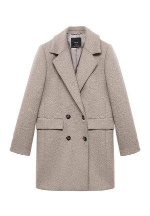 Double-breasted beige wool coat with large lapels, two front pockets, and black buttons. Smooth texture and structured shape.