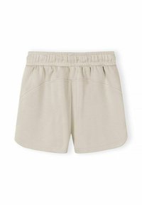 Shorts beiges avec ceinture élastique, coutures latérales courbées et ourlet légèrement arrondi, conçus pour un usage décontracté.